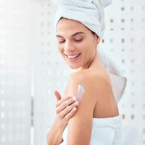 woman applying product on her body