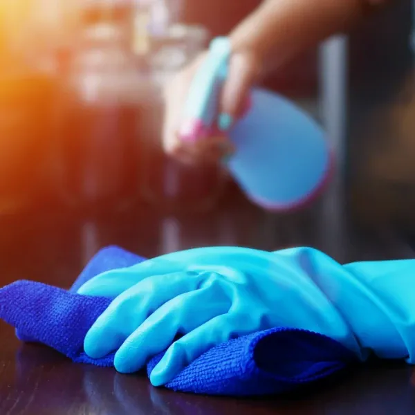 disinfecting a surface using a disinfectant and piece of cloth