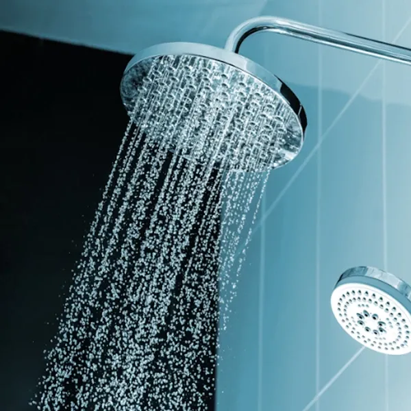 a picture of a showerhead from which water is running