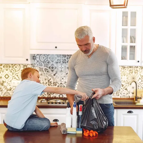 A boy with father on kitchen