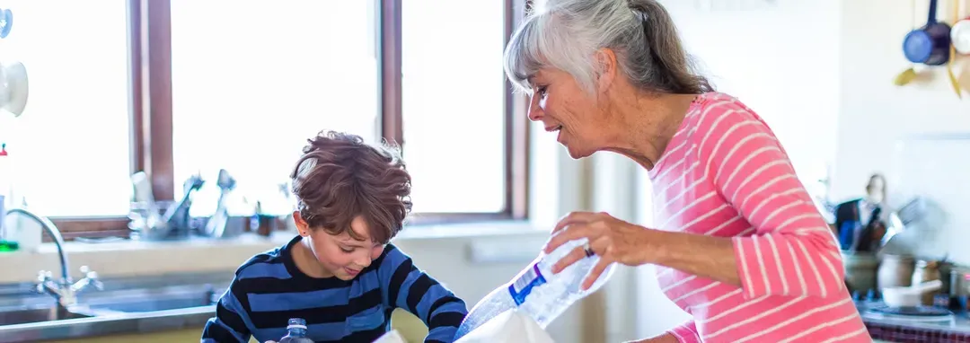 Grandmother and a kid on the kitchen