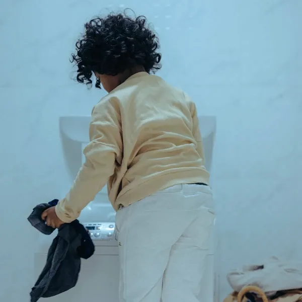 A kid with washing machine